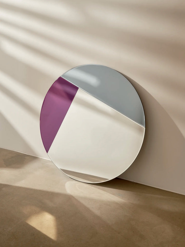 Nouveau 90 Mirror by Reflections Copenhagen with geometric purple segment, 1980s inspired elegance.