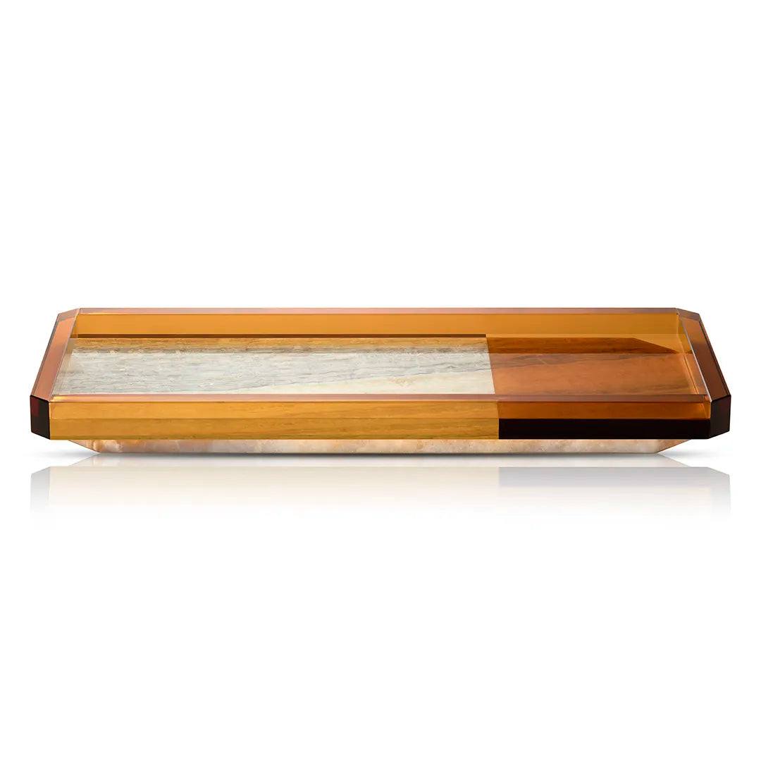 The Shadow Tray in a studio setting, showcasing its translucent caramel frame, geometric edges, and elegant marble inlay.