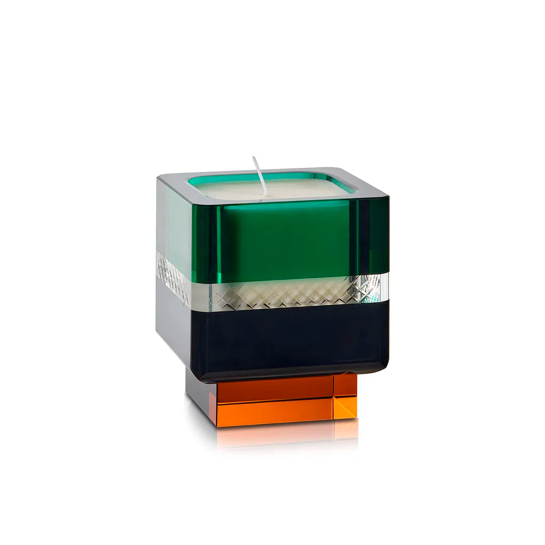 A product shot of the Soirée Home Scent candle, showcasing its emerald green upper, black crystal middle, and amber base against a white background.