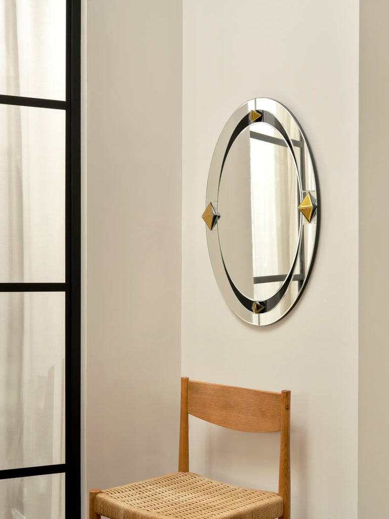 Darling Small Mirror by Reflections Copenhagen, mid-century oval design with gold and black accents, suited for contemporary interiors.