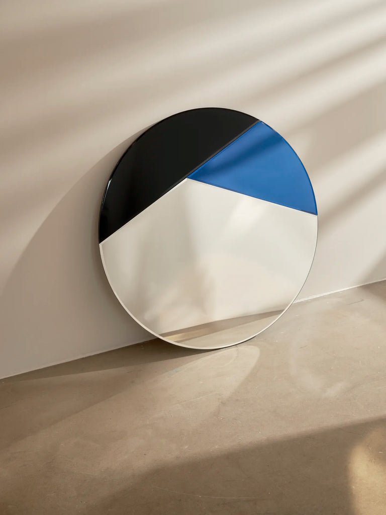 Nouveau 80 Mirror by Reflections Copenhagen, circular with bold black and blue geometric shapes, 1980s geo-style.