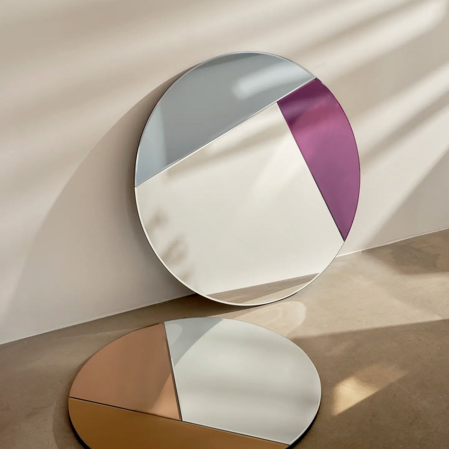 Reflections Copenhagen Nouveau 90 and 70 Mirrors, geometric design with bold purple and bronze segments.